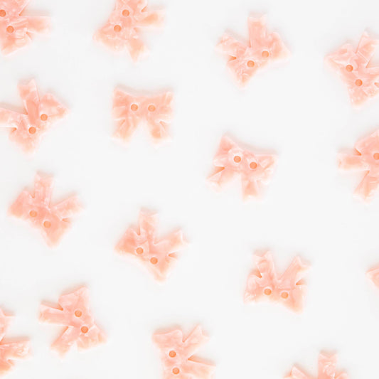 Grands boutons roses avec nœud de 1"